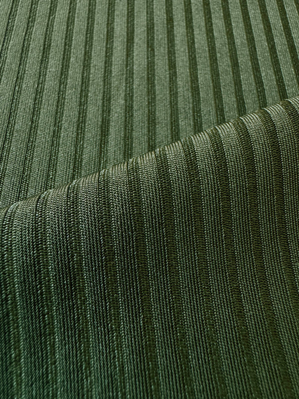 close up on lemlem Beri Olive swom fabric featuring rich olive green color and a soft, silky ribbed texture