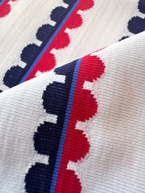 Close-up of fabric with red, blue, and white pattern