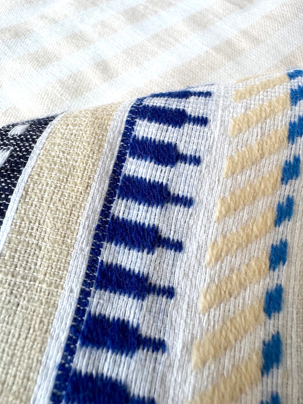 Close up on lemlem iniku shell fabric  featuring bold two-tone stripe pattern in watermelon pink and soft rosy cream