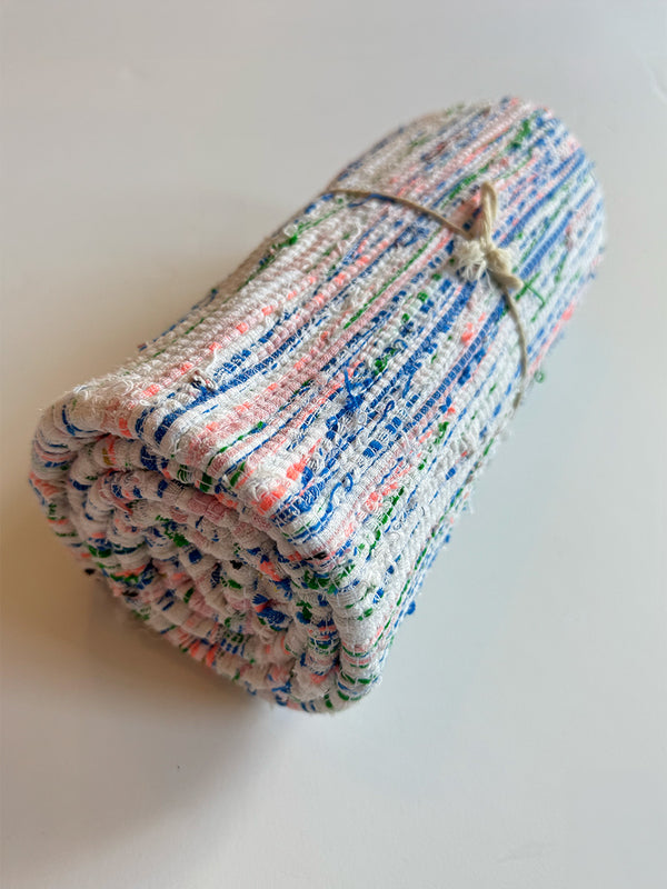 Product shot of lemlem upcycled handwoven MESFIN Rug with multicolored patterns