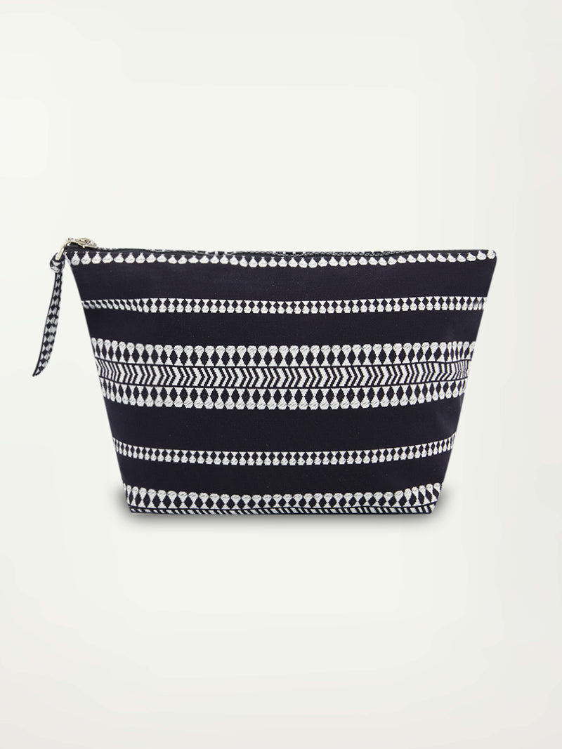 Product picture of a black travel pouch featuring horizontal geometric white stripes and a black zip closure at the top.