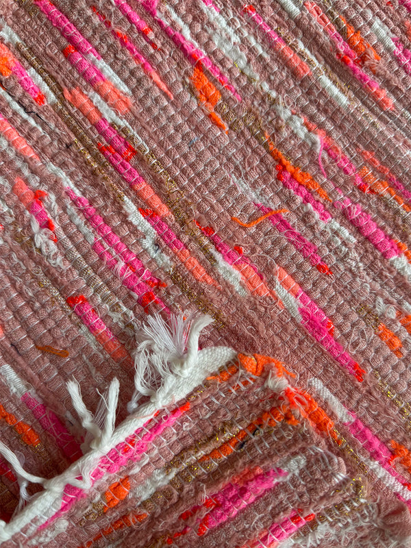 Product shot of lemlem upcycled handwoven MESFIN Rug with multicolored patterns