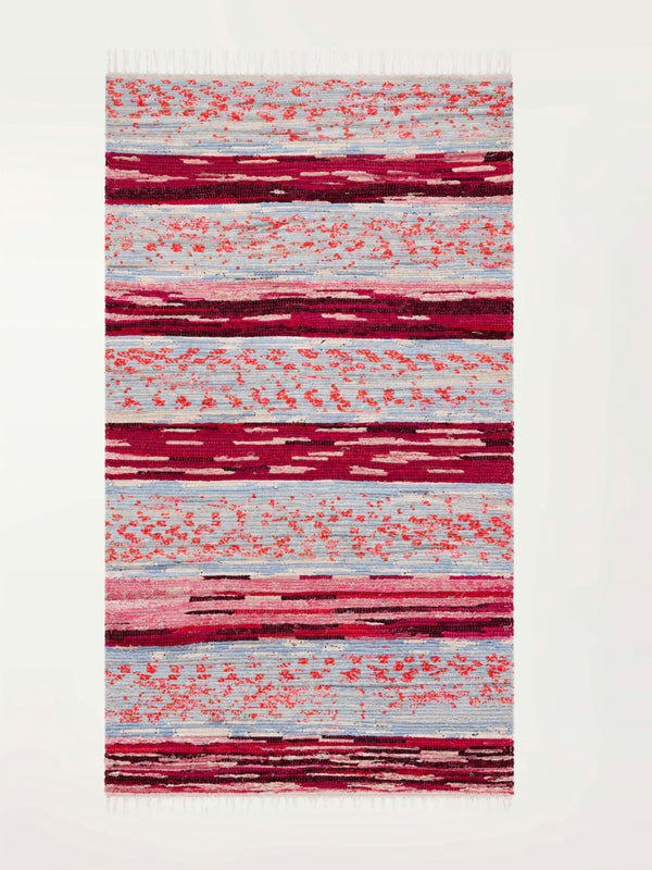 Product shot of lemlem upcycled handwoven MESFIN Rug with multicolored patterns