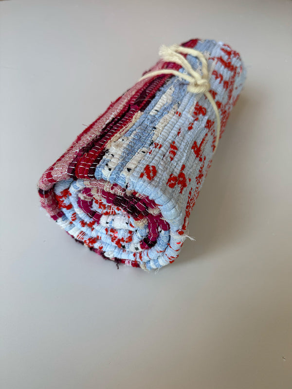 Product shot of lemlem upcycled handwoven MESFIN Rug with multicolored patterns