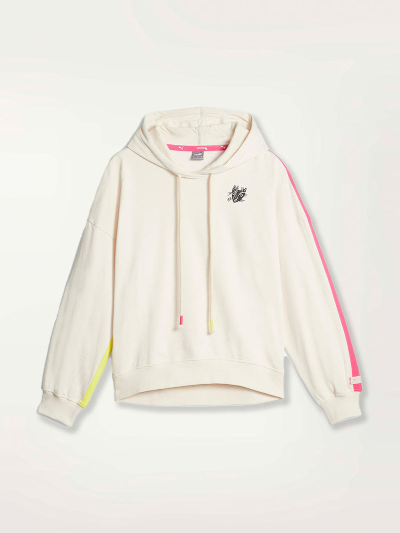  Product Shot of a Puma x lemlem oversized hoodie in Ghost Pepper Color featuring hand sketched cat logo and color block stripes in bright pink and yellow colors. 