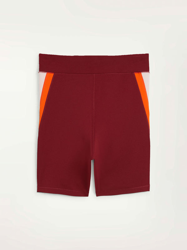 Product Back Shot of Puma x lemlem Biker Shorts Featuring Team Regal Red Color and color block details on hips in Warm White and Cayenne Pepper Colors