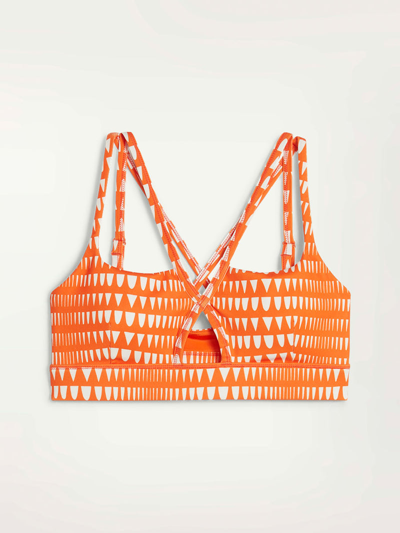 Product Front Shot of Puma x lemlem Low Impact Bra in Cayenne Pepper Color Featuring lemlem Triangle Pattern in White Color