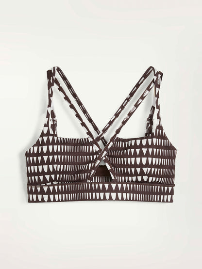 Product Front Shot of Puma x lemlem Low Impact Bra in Dark Chocolate Color Featuring lemlem Triangle Pattern in White Color