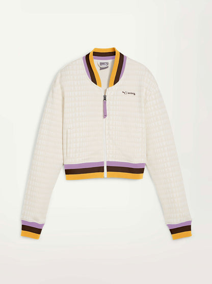 Product Front Shot of Puma x lemlem Jacket Featuring Warm White Color, lemlem triangle pattern and color stripe details on the waistband, cuffs and the collar