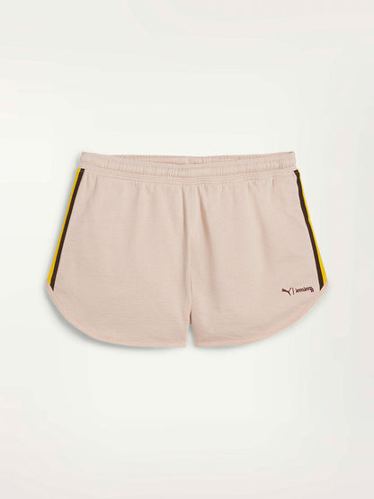 Product Front Shot of Puma x lemelm Shorts Featuring Rose Quartz Color and Color Block Stripe Details on the hips