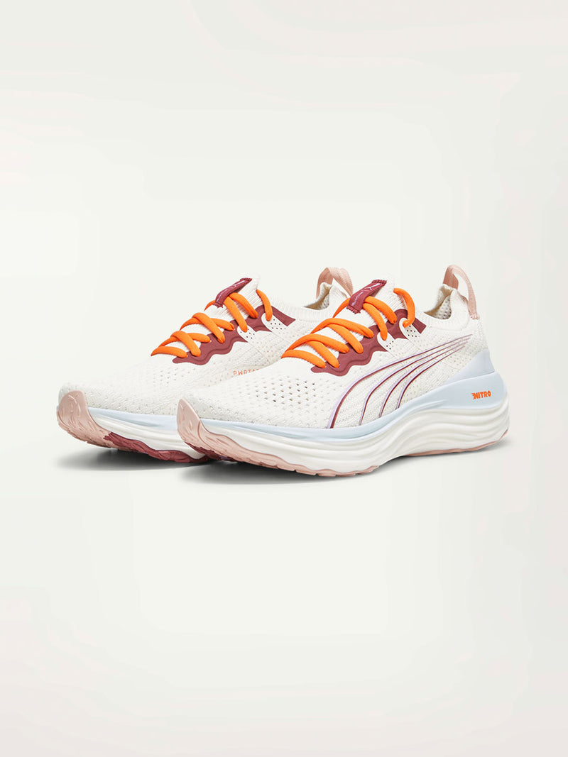 Product Front Shot of a Puma x lemlem ForeverRUN Nitro Shoes featuring Icy Blue, Warm White, colors and color details in Cayenne Pepper and Team Regal Red