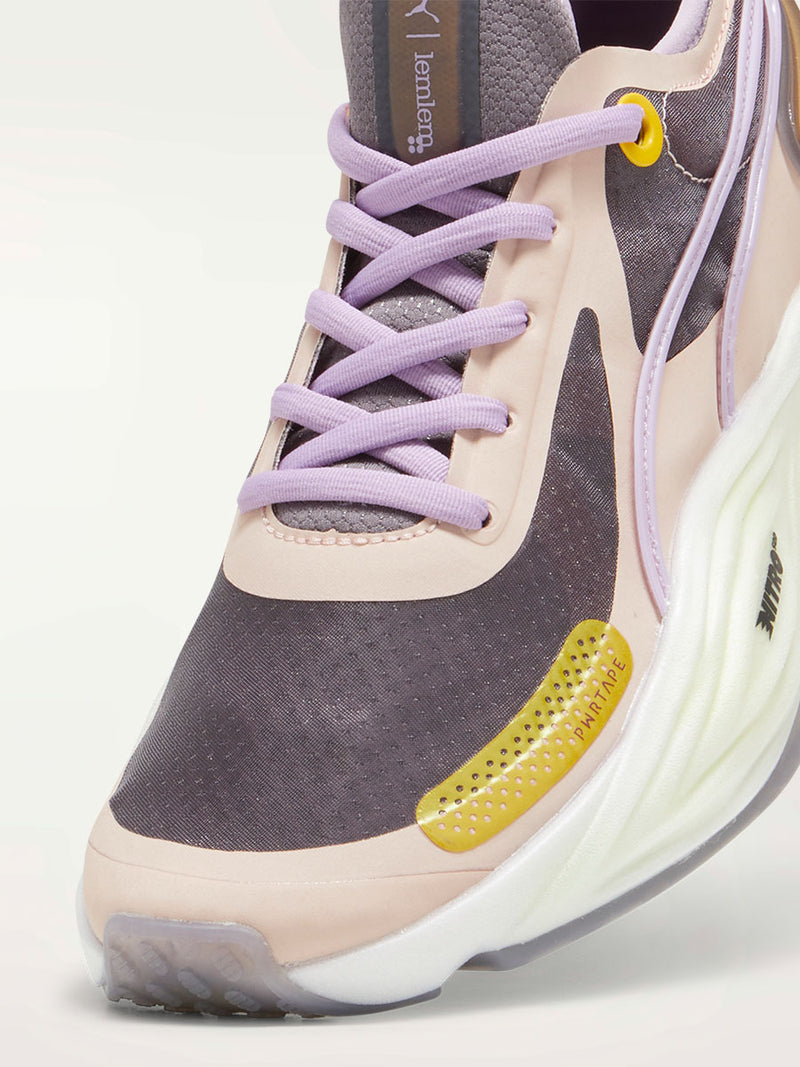Product Close Up Shot of a Puma PWR XX NITRO™ Women's Training Shoes featuring a premium knitted upper in Dark Choclate Color, Violet Laces, warm white sole and Yellow Details