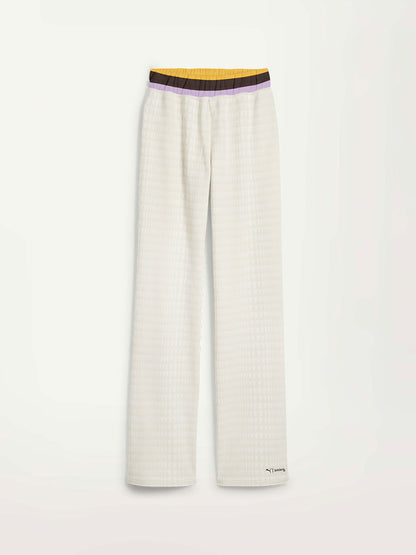 Product Front Shot of Puma x lemlem Pants Featuring Warm white color, lemlem triangle pattern, color block waist and puma x lemlem logo on the Front