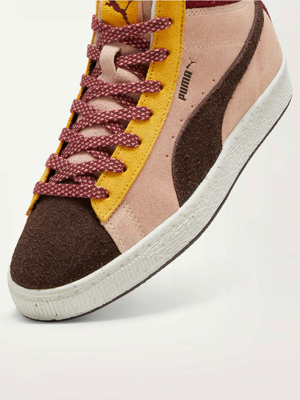 Product Side Close Up Shot of Puma x lemlem Suede Sneakers Featuring Color Accents in Dark Chocolate and Red Colors