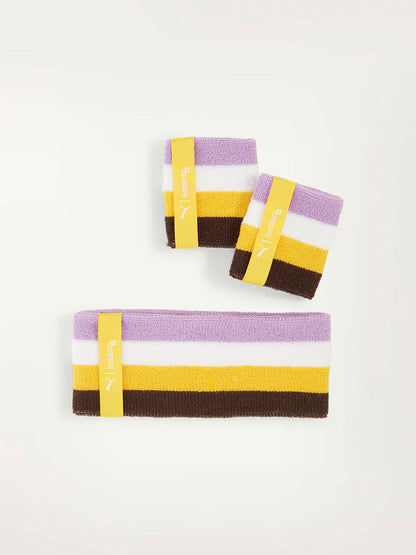 Product Front Shot of Puma x lemlem Swetband set including two wristbands and one headband featuring color block pattern in violet, yellow, dark chocolate and white colors