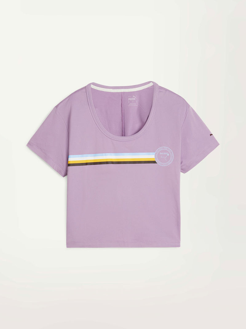 Product Front Shot of Puma x lemlem Tee in Vivid Violet Color featuring color stripe detail on the  front