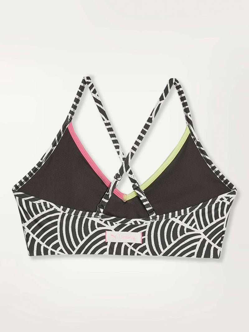 Product Back  Shot of a Puma x lemlem low impact bra featuring hand sketched scallop print in Ghost Pepper  and Black colors and color block side stripes in bright pink and green colors