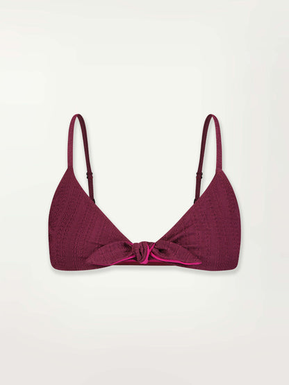 Product front shot of a Sara Tie Front Top Featuring featuring a downsampled Jordanos Pattern in a luxurious burgundy hue