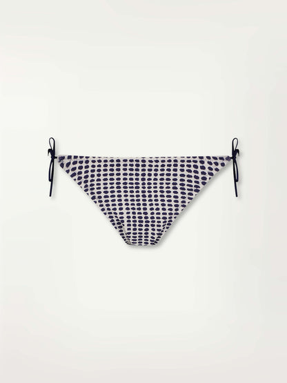 Product Front Shot of the Rekka String Bikini Bottom Featuring Blue Dotted Pattern