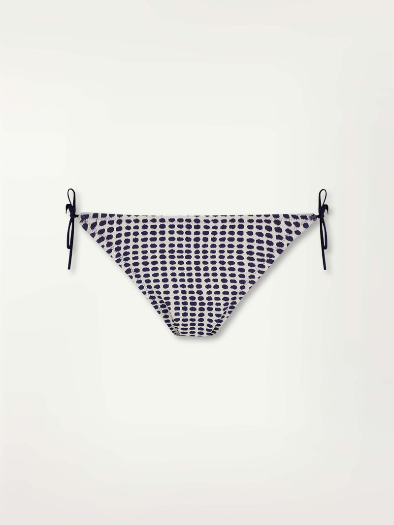 Product Front Shot of the Rekka String Bikini Bottom Featuring Blue Dotted Pattern