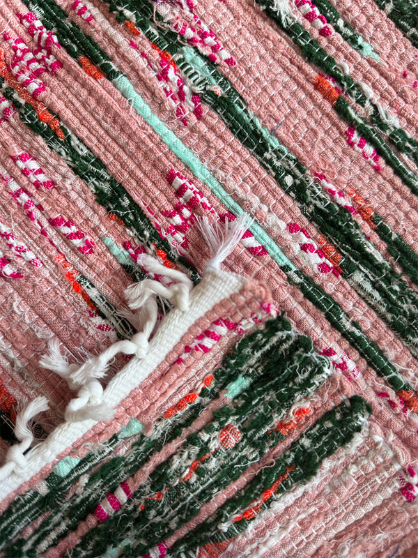 Product shot of lemlem upcycled handwoven MESFIN Rug with multicolored patterns