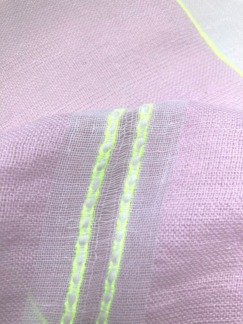 Close up on a Ruti Orchid Fabric Featuring lilac orchid color complemented by hints of citron neon.