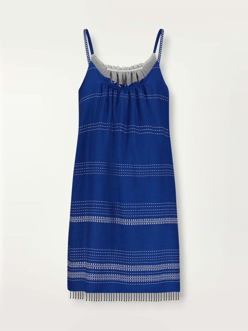 Product back shot of the Inku Swing Dress featuring textured white dots on deep blue background.
