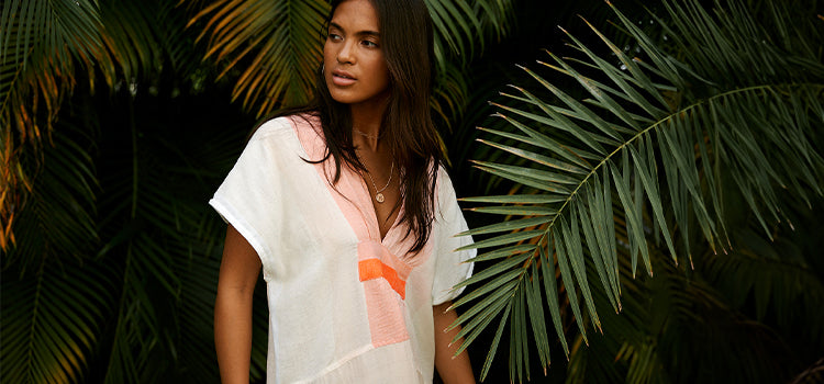 Woman Standing Wearing Gasira Caftan in Ayele Blush Color