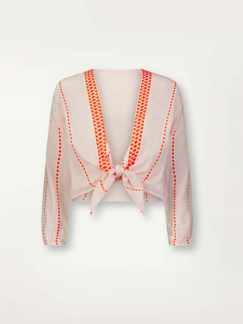 Product front shot of lemlem handwoven Pink top with red stitching on a white background