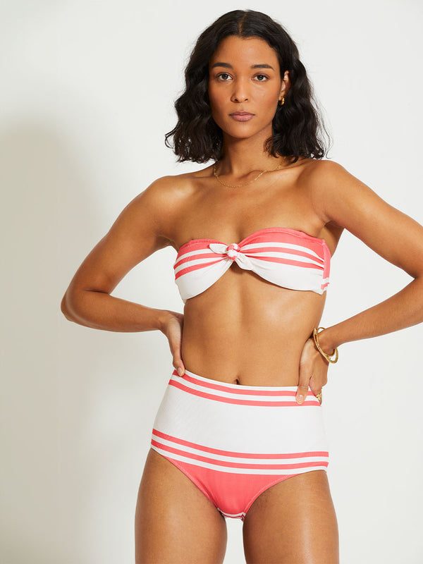 Woman Standing Wearing lemlem ELSI | High Waist Bottom featuring bold two-tone stripe pattern in watermelon pink and soft rosy cream
