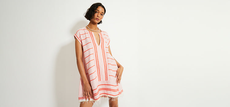 Woman Standing Wearing lemlem Bela Petal Caftan Dress
