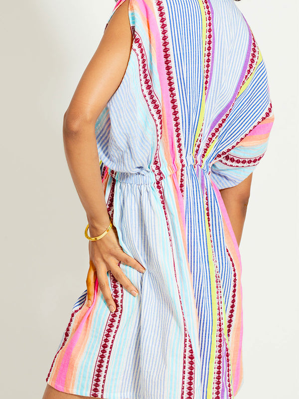 Close up on a Woman Standing Wearing lemlem ALEM | Plunge Dress featuring  intricate stripes in sun-washed hues and a Tibeb-inspired pattern in rich dark plum