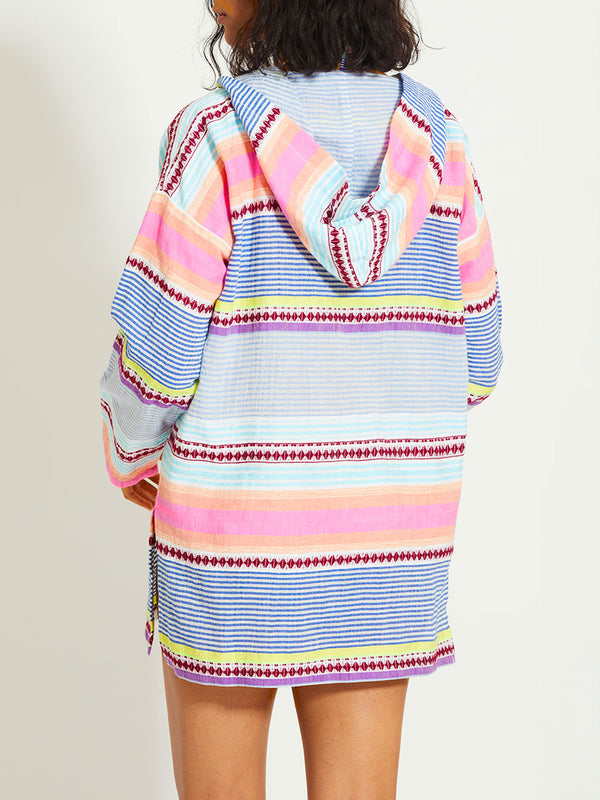 Back of a Woman Standing Wearing lemlem HENOK | Hoodie featuring  intricate stripes in sun-washed hues and a Tibeb-inspired pattern in rich dark plum