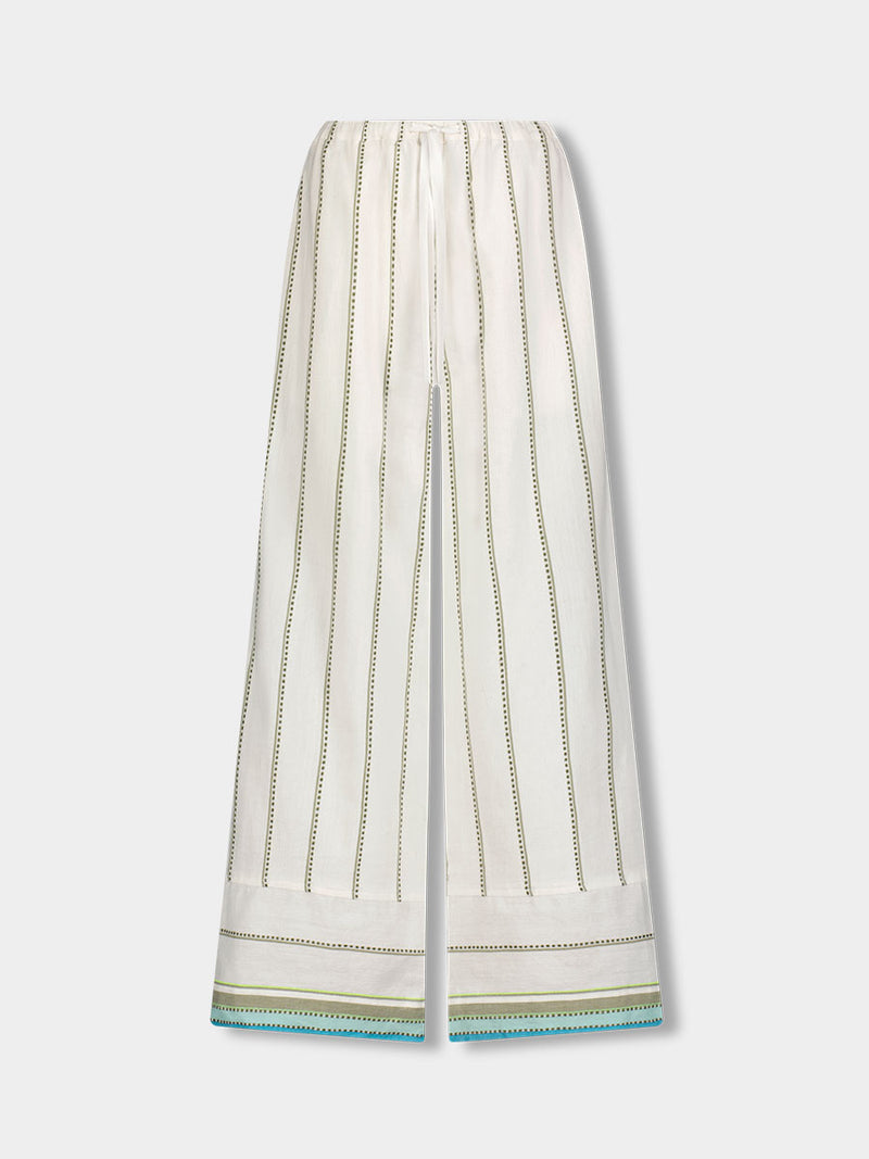 Product front shot of lemlem DESTA Pants featuring a chic stripe pattern in aqua blue and sage tones, delineated by dark olive dots and accented with a splash of neon yellow on a cream background