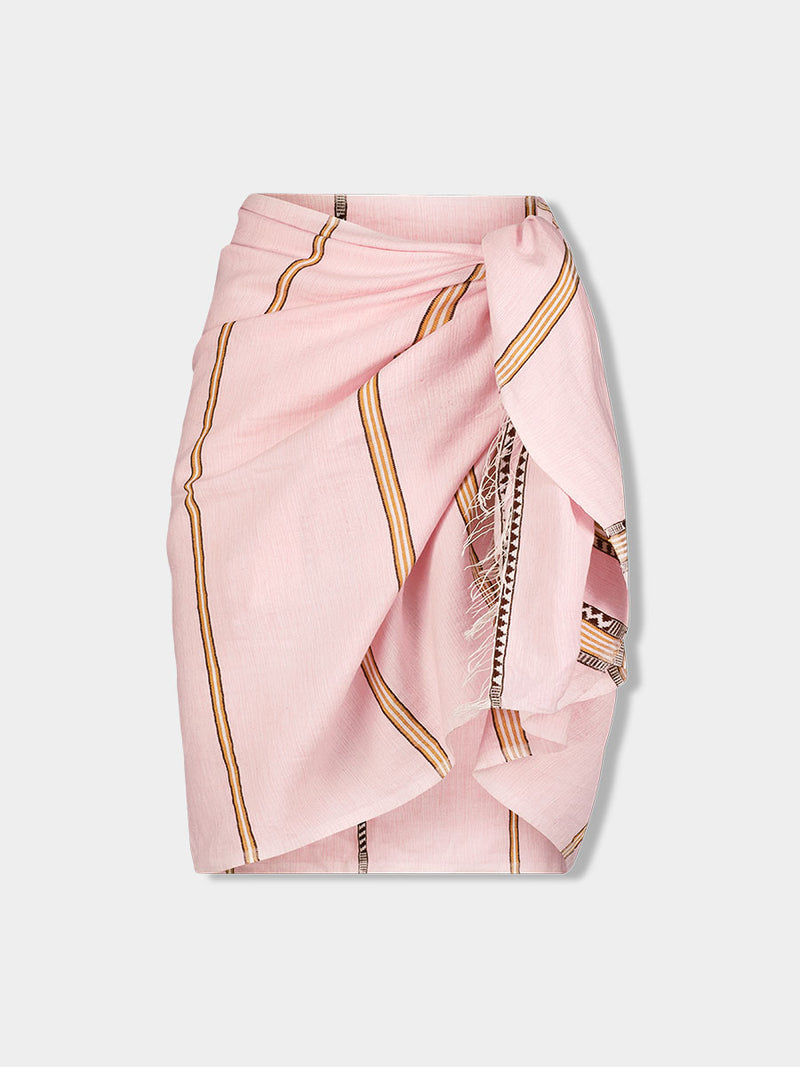 Product front shot of  lemlem LEMA Sarong featuring detailed bands of deep burgundy, bronze, and pink stripes beautifully placed on a light cream 