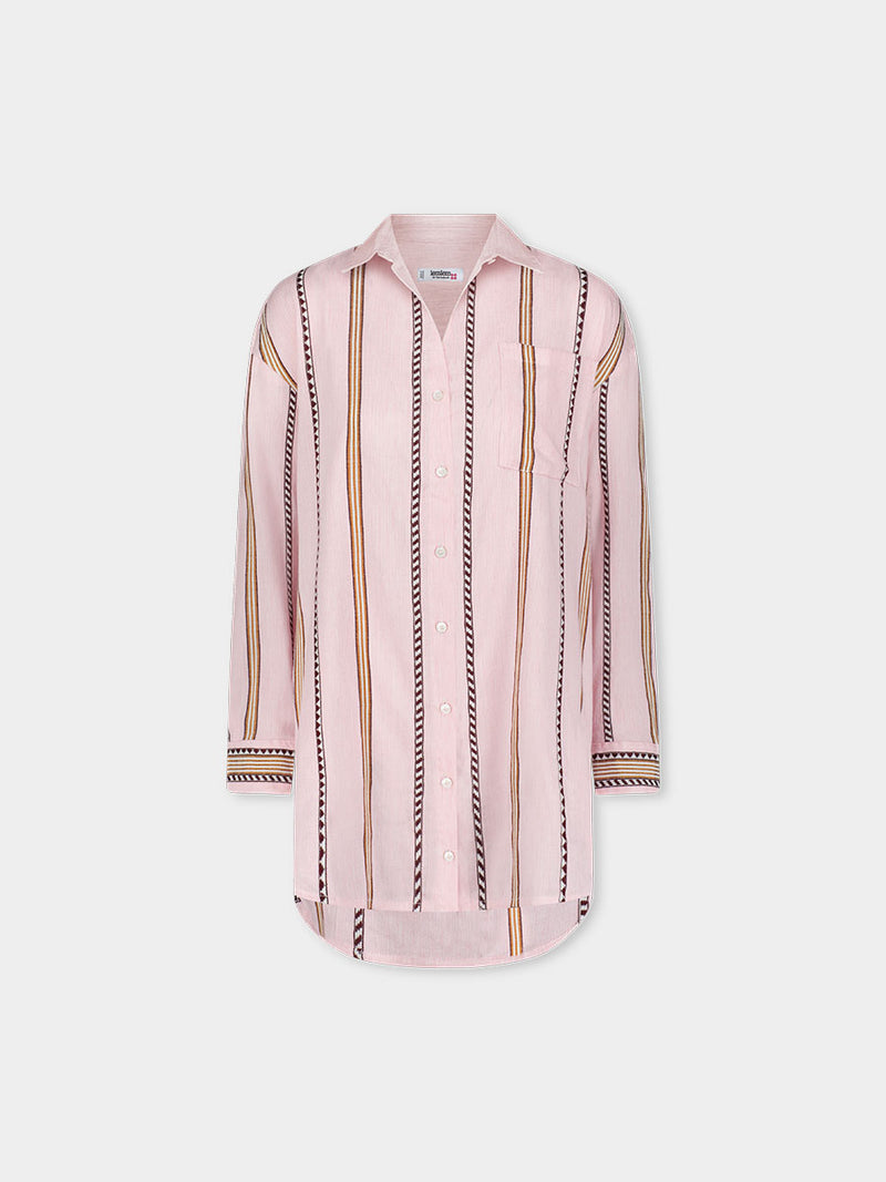 Product front shot of lemlem handwoven MARIAM Shirt  featuring detailed bands of deep burgundy, bronze, and pink stripes beautifully placed on a light cream 