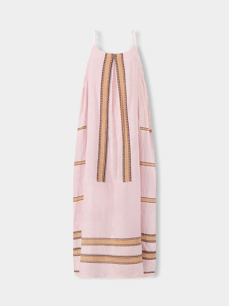 Product front shot of  lemlem NIA Dress featuring detailed bands of deep burgundy, bronze, and pink stripes beautifully placed on a light cream 