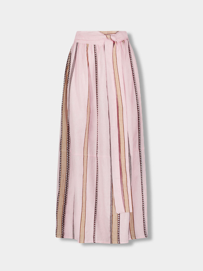 Product front shot of  lemlem TOLA Skirt featuring detailed bands of deep burgundy, bronze, and pink stripes beautifully placed on a light cream 