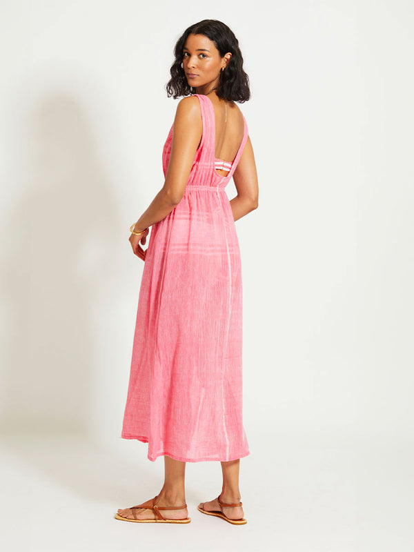 Back of a Woman Standing Wearing lemlem MELAT | Scoop Neck Dress featuring sheer fabric in pink watermelon color