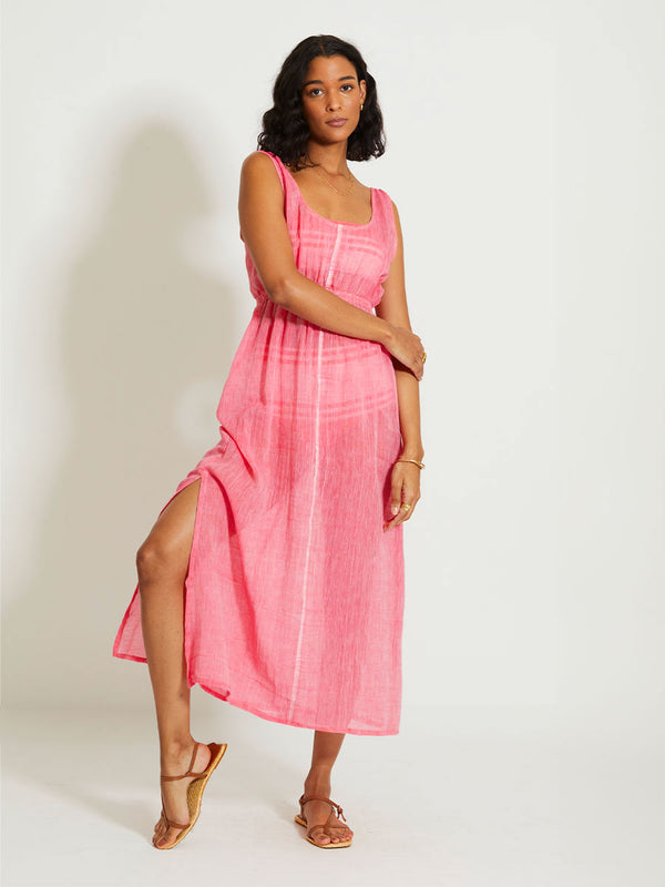 Woman Standing Wearing lemlem MELAT | Scoop Neck Dress featuring sheer fabric in pink watermelon color