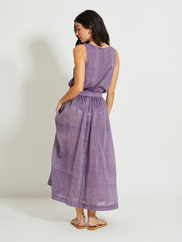 Back of a Woman Standing Wearing lemlem KATI | Tank Top featuring sheer fabric in rich plum color