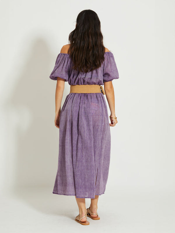 Back of a Woman Standing Wearing lemlem RAHEL | Off Shoulder Dress featuring sheer fabric in rich plum color