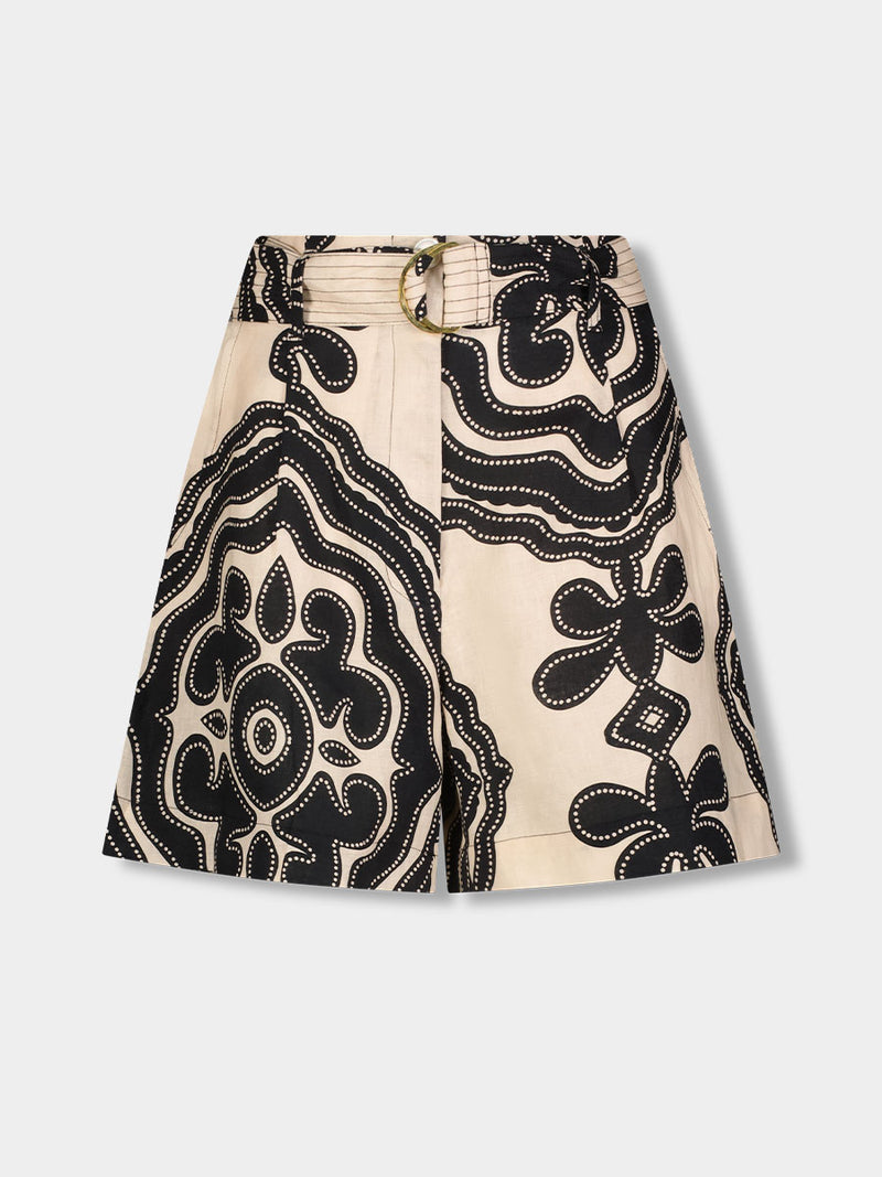 Product front shot of  lemlem FAIZAH Shorts featuring ancient inspired pattern in black color on cream background and beige denim shorts