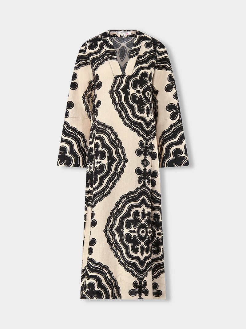 Product front shot of  lemlem THEODORA Dress featuring ancient inspired pattern in black color on cream background and beige denim shorts