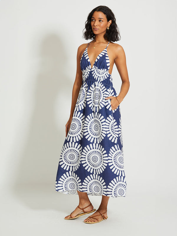 Woman Standing Wearing lemlem GETE | Triangle Dress Featuring a bold geometric medallion pattern on navy background, inspired by traditional Tibeb motifs.