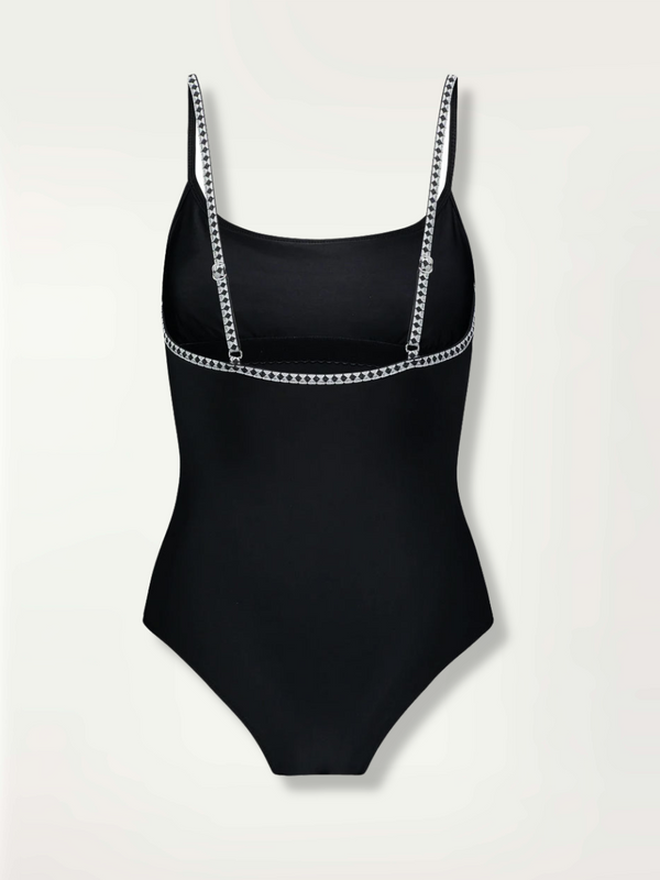 Product-shot of the back of the Lena Classic One Piece in Black featuring a black and white tibeb trim.