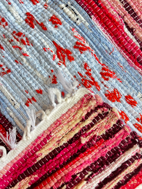 Product shot of lemlem upcycled handwoven MESFIN Rug with multicolored patterns