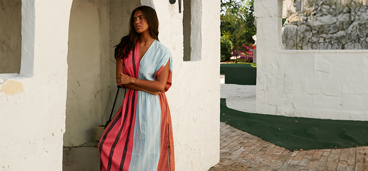 Woman Standing Wearing Leila Plunge Dress in Zula Layercake color