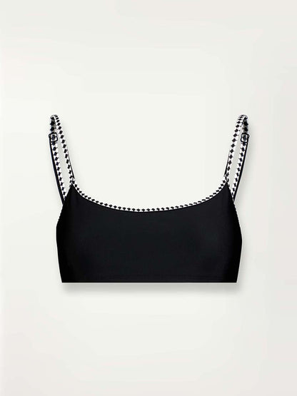 Product shot of the front of the Lena Bralette Top in Black featuring black and white tibeb straps
