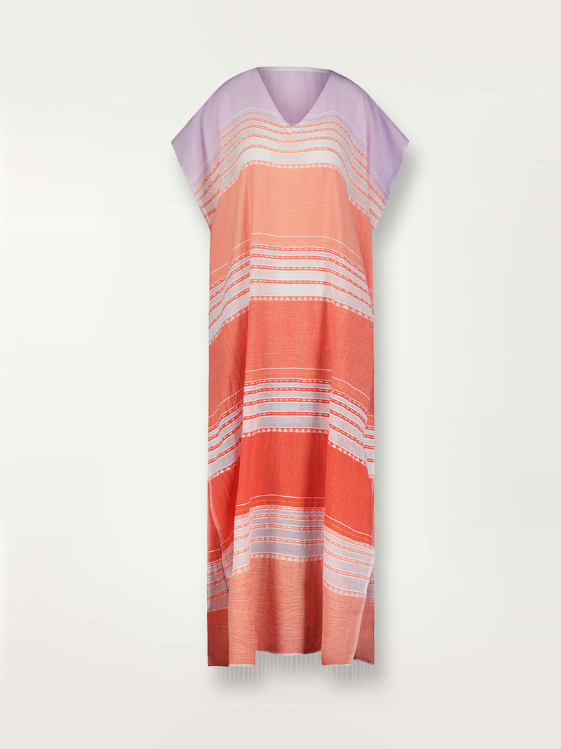 Product shot of the Eshal Caftan Dress featuring white doted stripes with gradiant orange and tangerine bands on a lilac and white background.